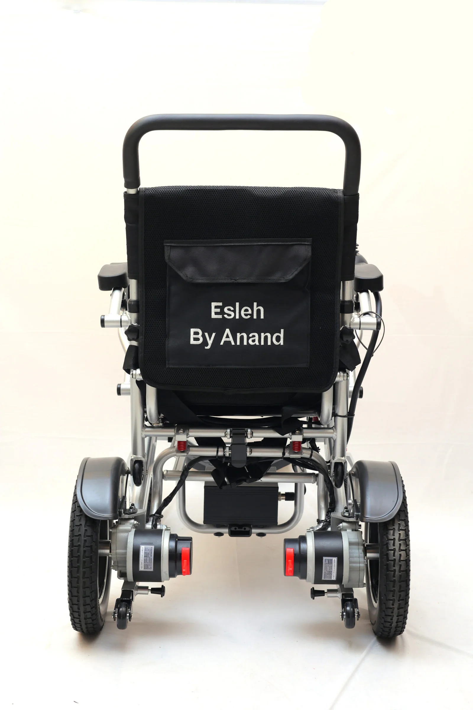 Esleh Auto Fold rear view showing 12-inch solid wheels and safety lights